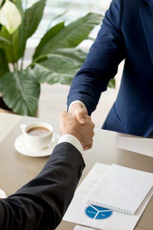 Gino Rodrigues closing a commercial financing deal with a client